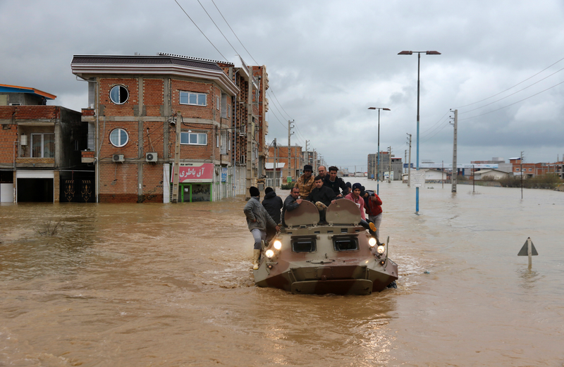 Military rescue boats search for survivors in Aq Qala, Iran.